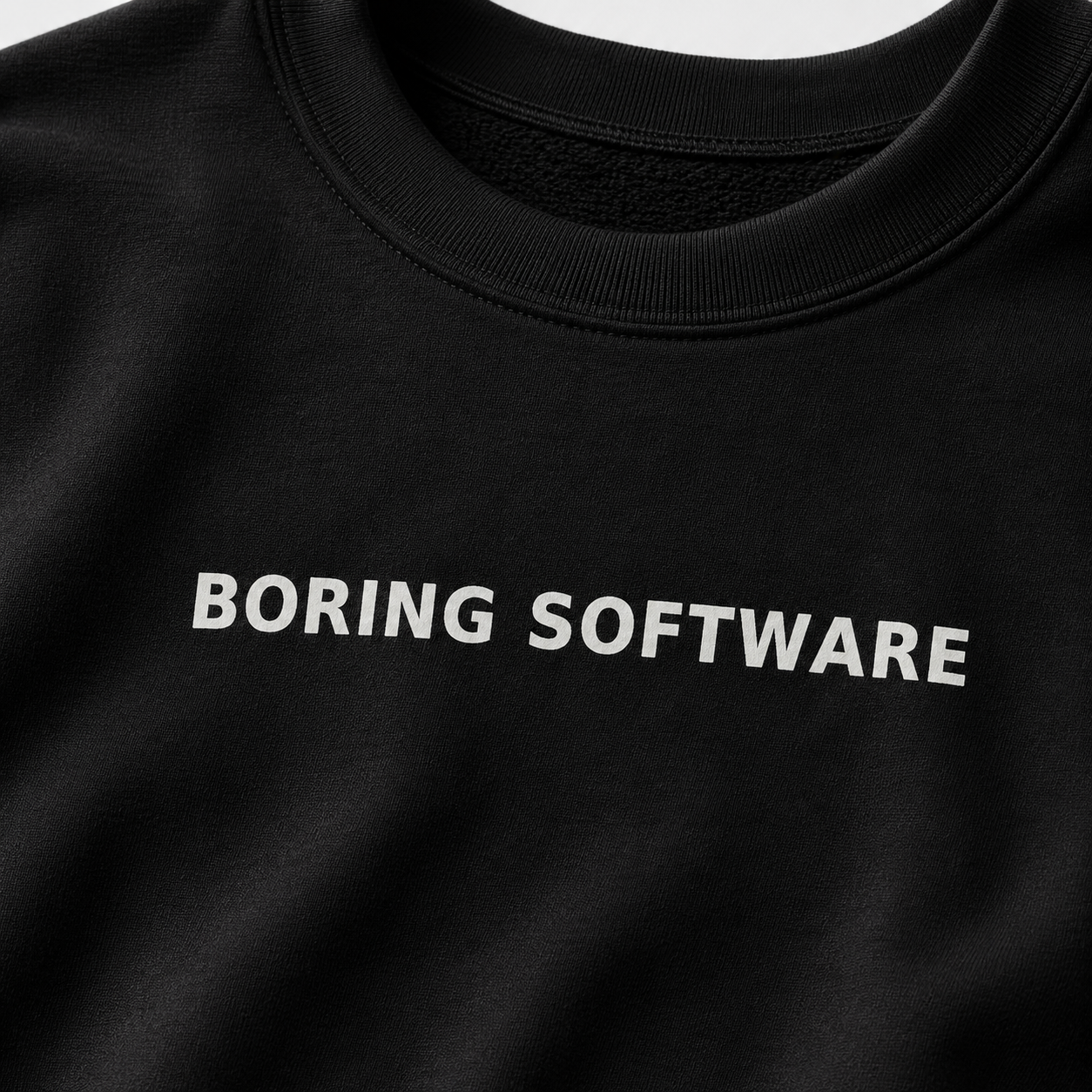 Black t-shirt with 'BORING SOFTWARE' text in white on a plain background