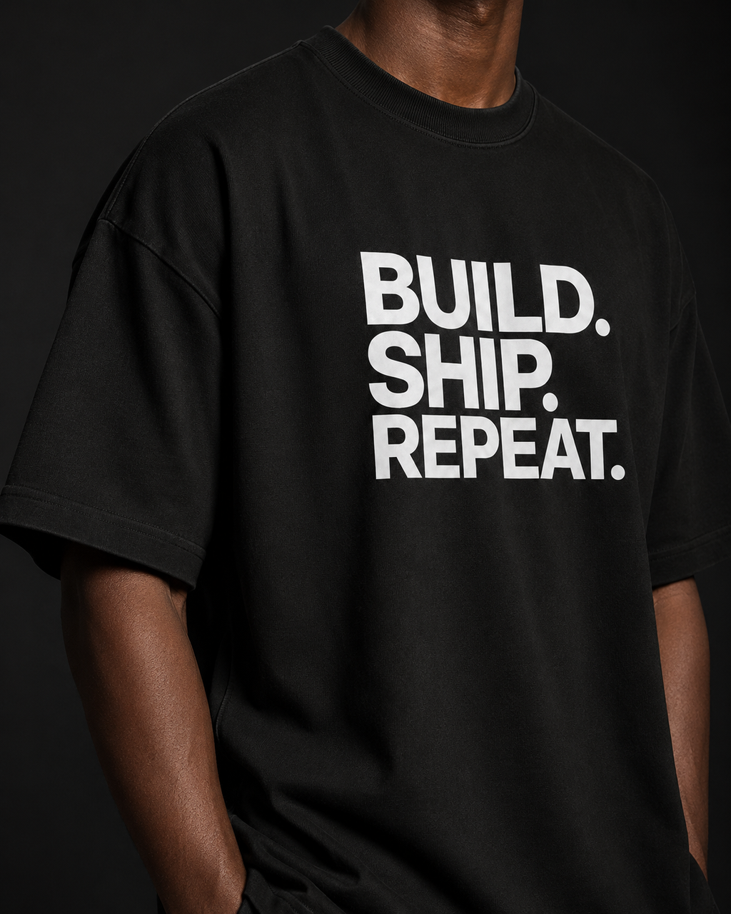 Black t-shirt with 'BUILD. SHIP. REPEAT.' text on a dark background