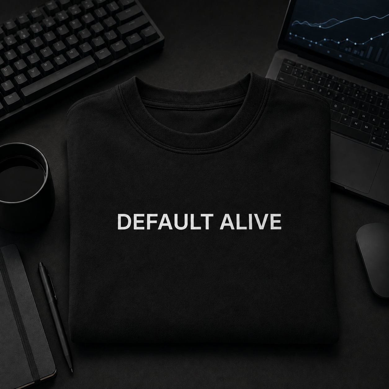 DEFAULT ALIVE black oversized terry t-shirt by BYTWEAR - flat lay on desk