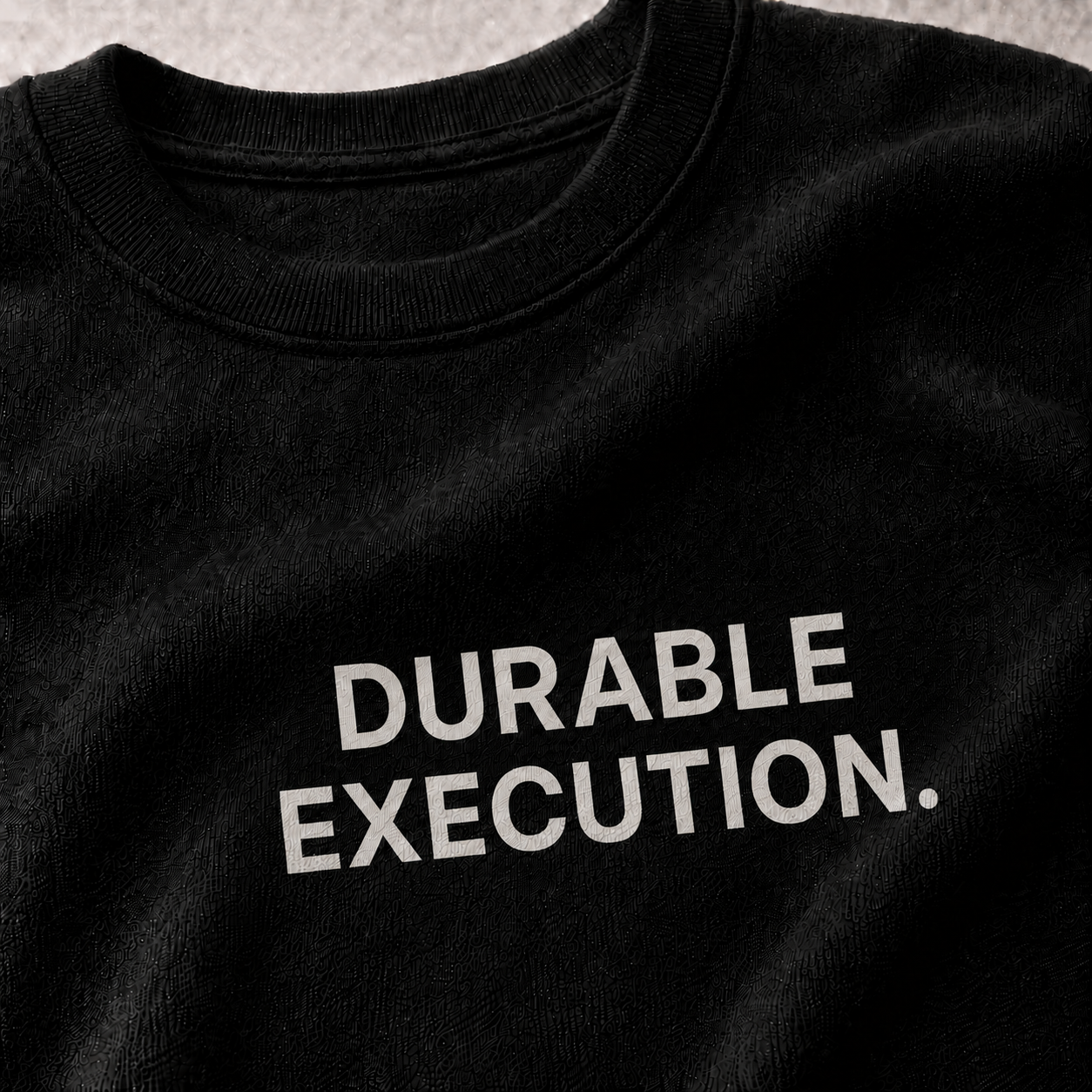 DURABLE EXECUTION. black oversized terry t-shirt by BYTWEAR - fabric and print detail
