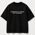 ENGINEERED TO ENDURE. NOT TO IMPRESS. black oversized terry t-shirt by BYTWEAR - front view