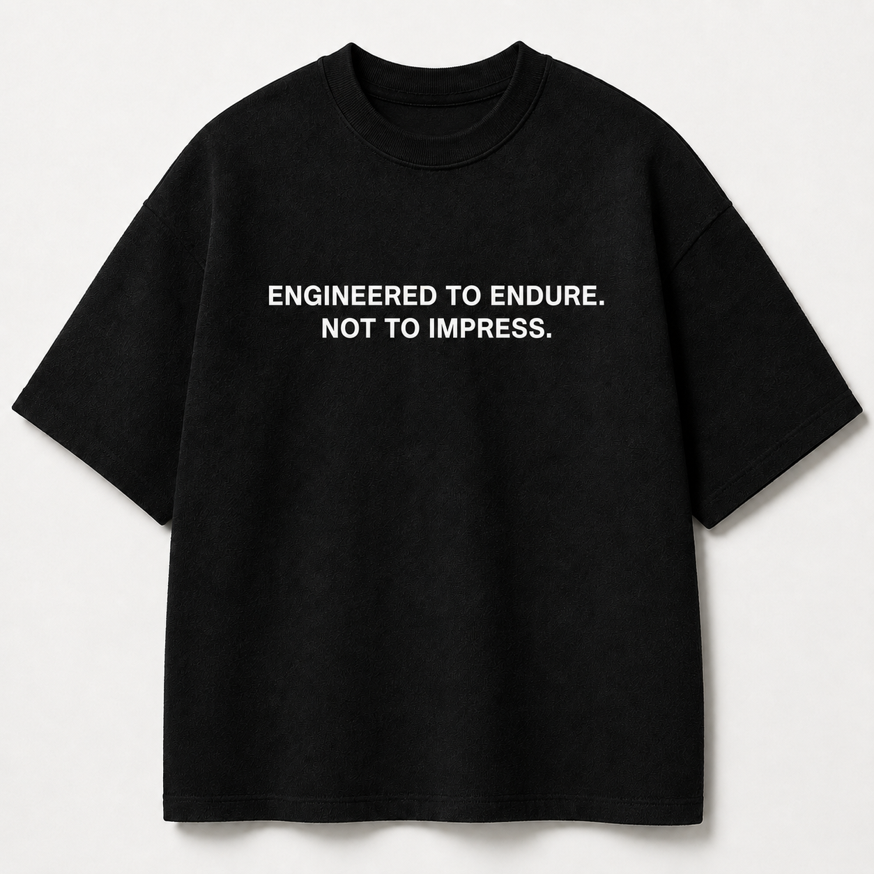 ENGINEERED TO ENDURE. NOT TO IMPRESS. black oversized terry t-shirt by BYTWEAR - front view