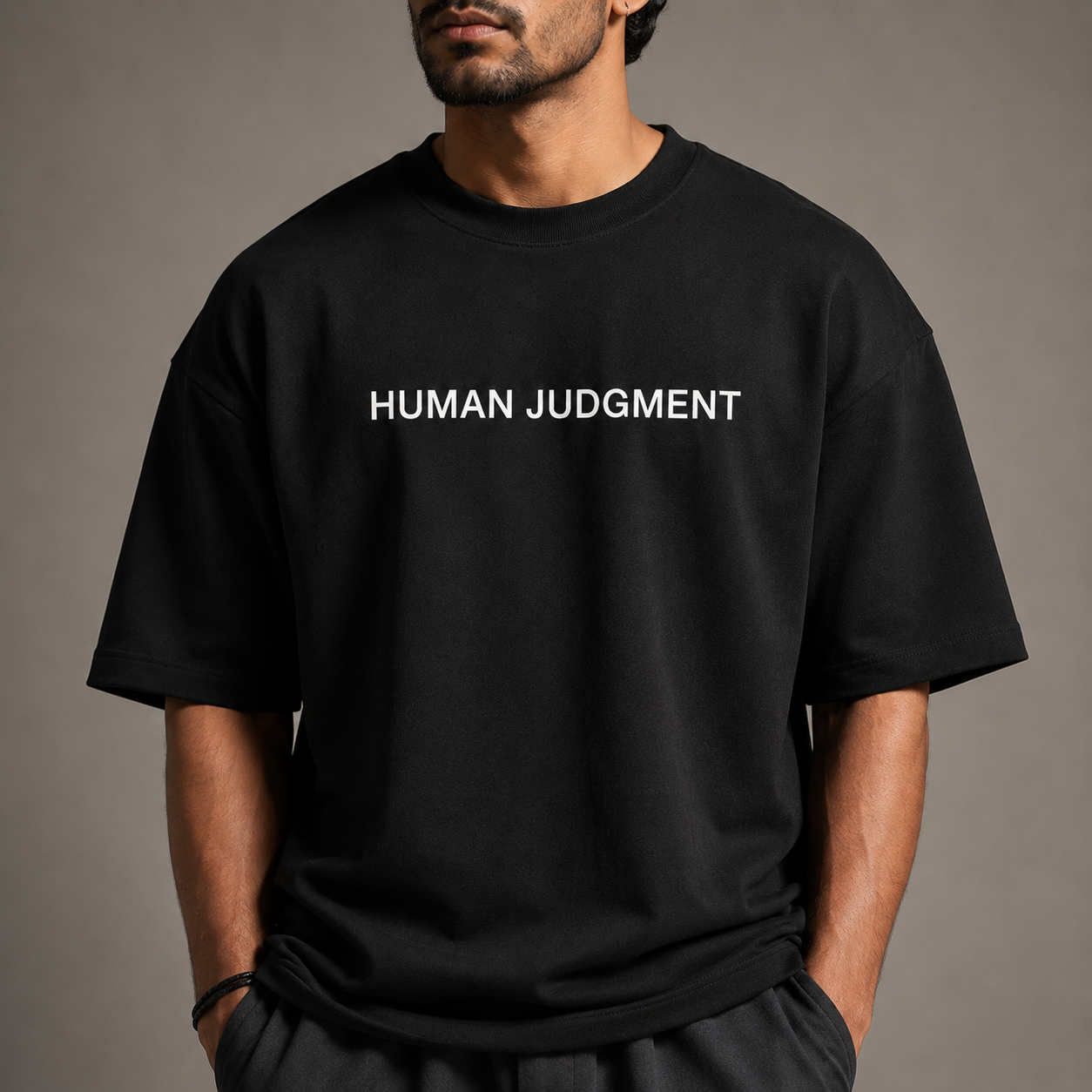 Oversized fit and drop shoulder detail of BYTWEAR HUMAN JUDGMENT t-shirt