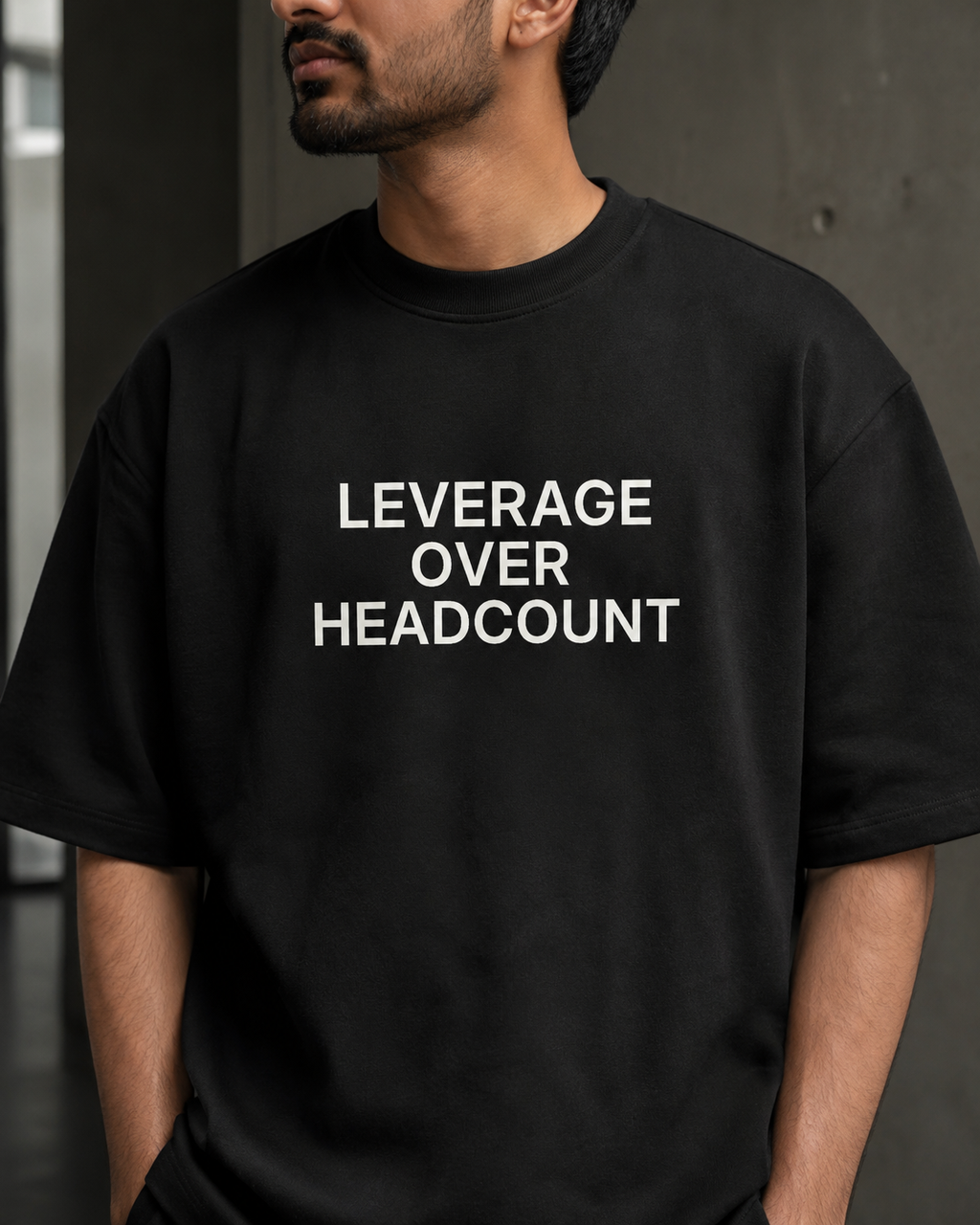 LEVERAGE OVER HEADCOUNT black oversized terry t-shirt by BYTWEAR - oversized fit detail