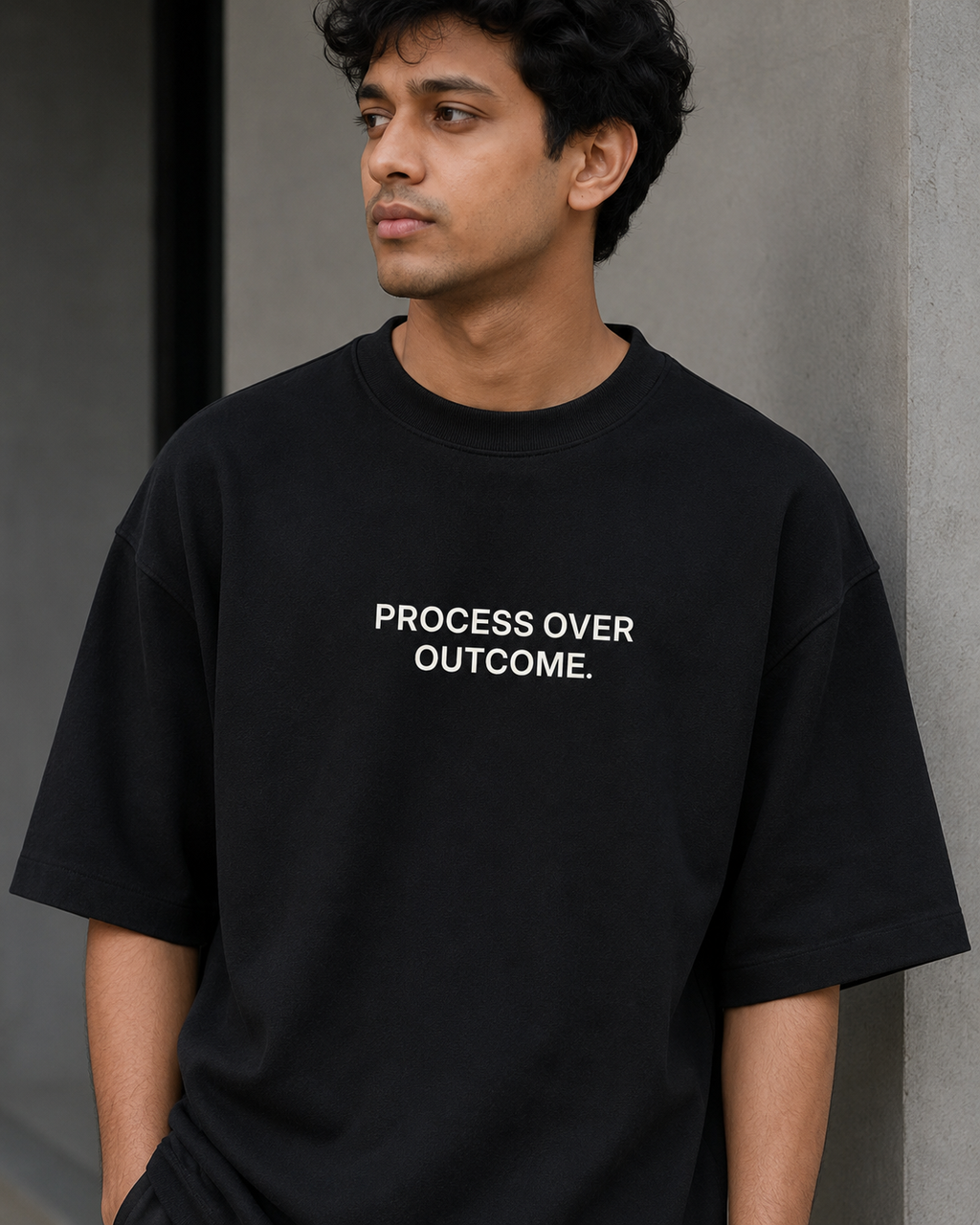 PROCESS OVER OUTCOME. black oversized terry t-shirt by BYTWEAR - oversized fit detail