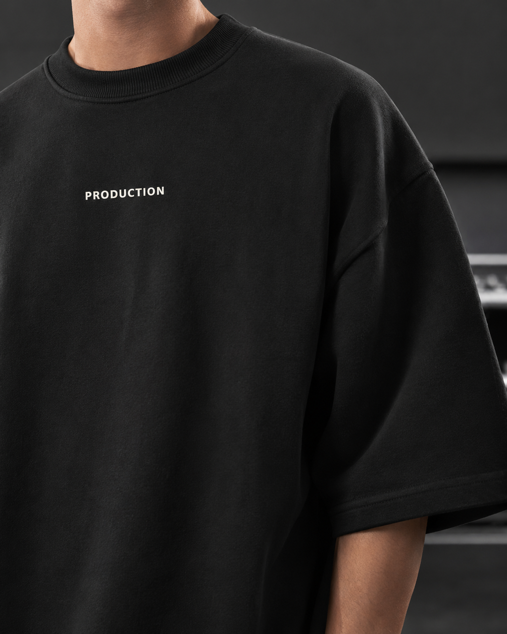 Black t-shirt with 'PRODUCTION' text on a dark background