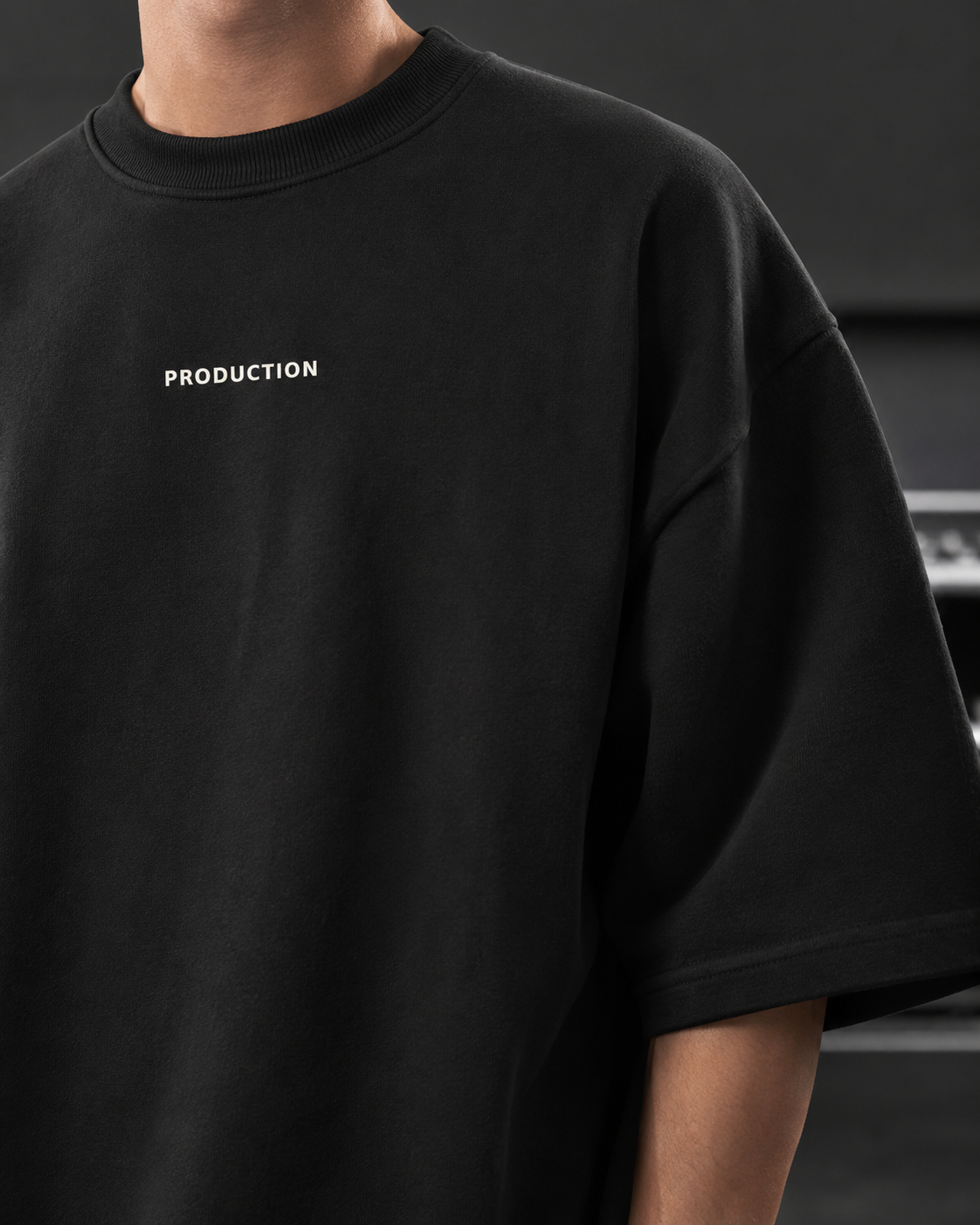 Black t-shirt with 'PRODUCTION' text on a dark background