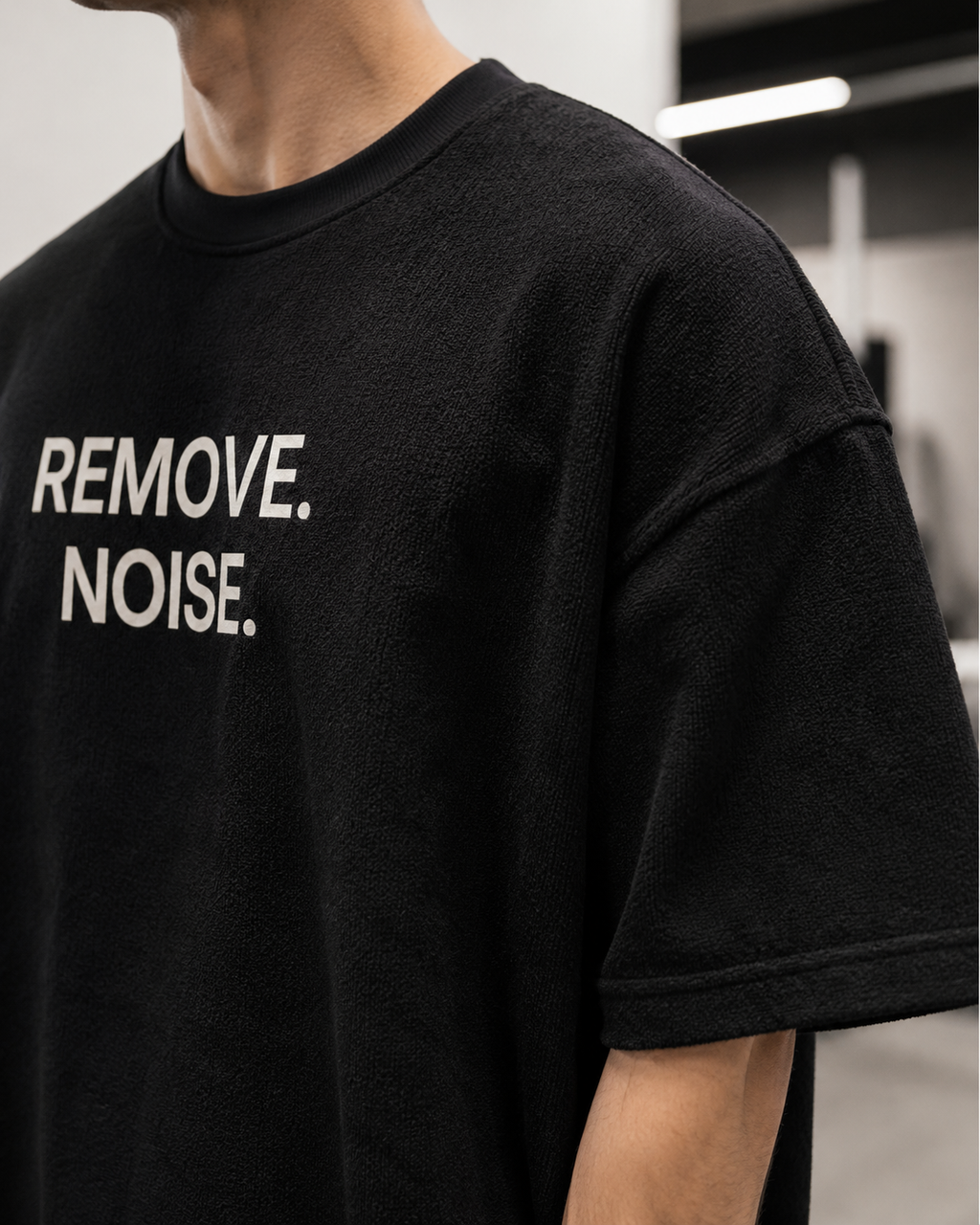 REMOVE. NOISE. black oversized terry t-shirt by BYTWEAR - fabric and print detail