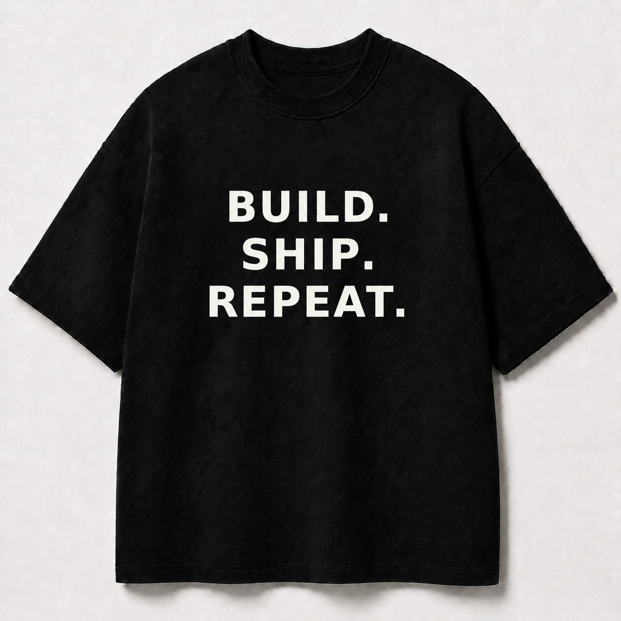 Build. Ship. Repeat. black oversized terry t-shirt by BYTWEAR - front view